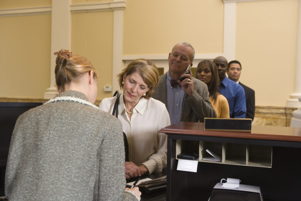 how traditional banking looks like and People waiting in line at bank