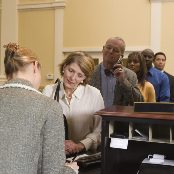 how traditional banking looks like and People waiting in line at bank