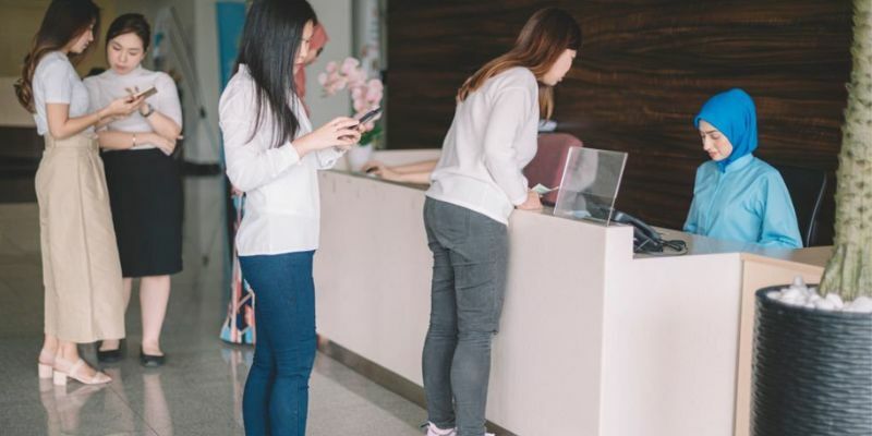 staff managing patient lines inn clinic