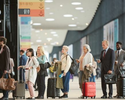 people waiting for the turn and using queue management solutions