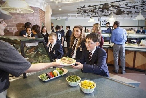 Lunch-being-served-in-school-cafeteria-in-FIFO-queue