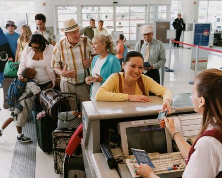 people are waiting in the queu at airport