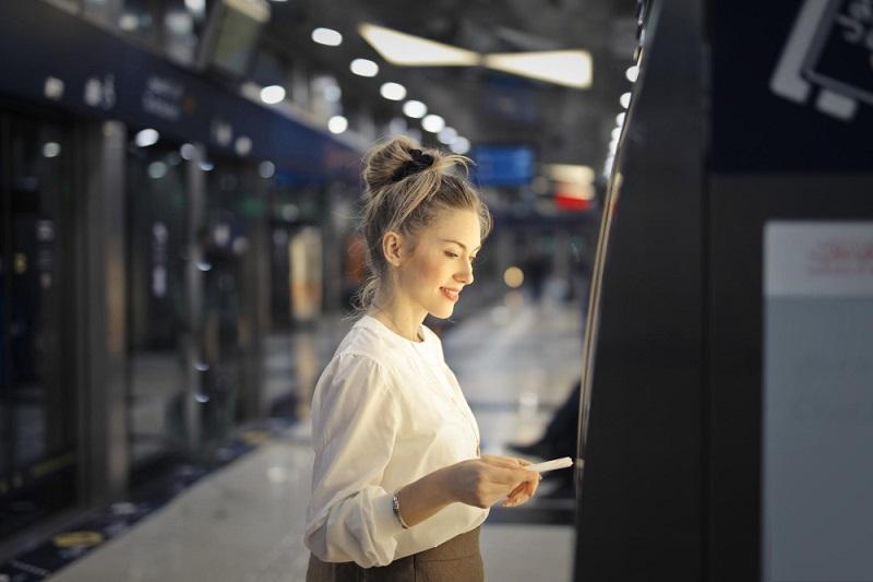 women is using self service kiosk