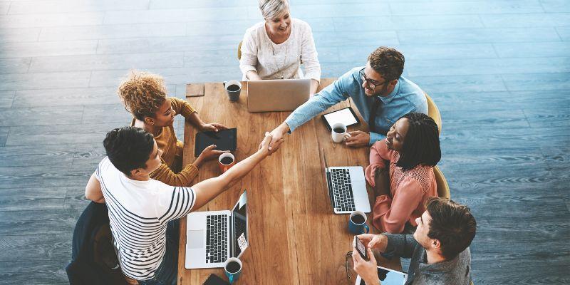 company-representatives-conducting-customer-onboarding-over-coffee