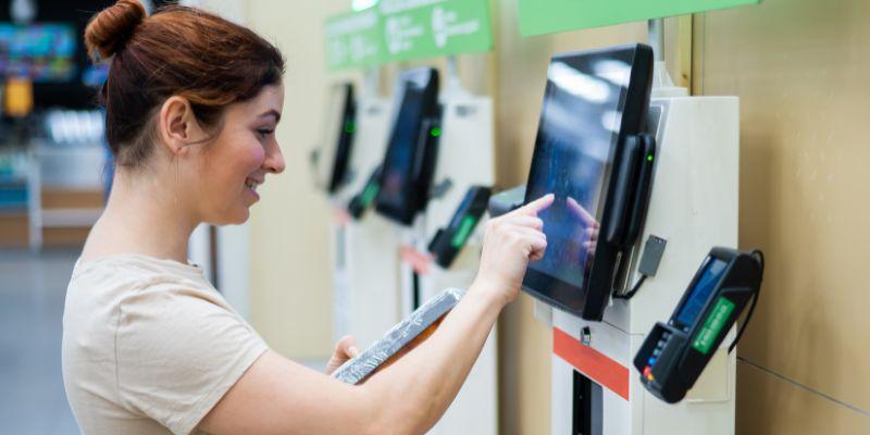 A-woman-using-self-service-kiosk