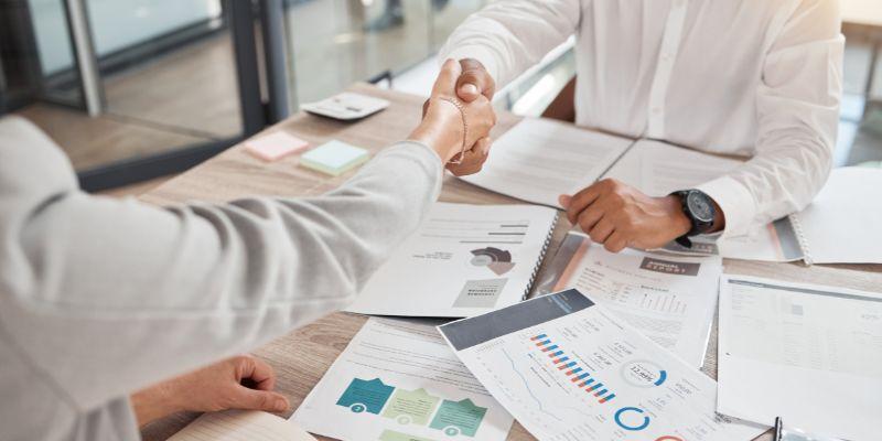 B2B-client-and-service-provider-meeting-with-documents-on-table